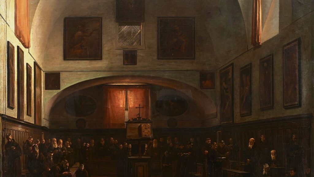 Frades capuchinhos de hábito e capuz longo rezando no coro de sua igreja em Roma