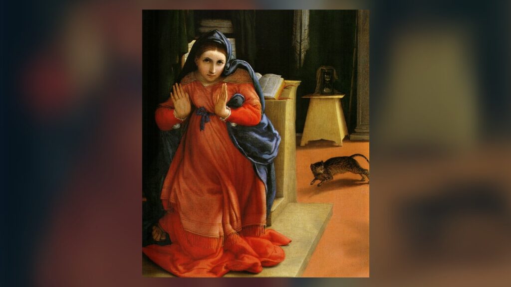 Maria se volta perturbada, com as mãos erguidas, ao ouvir a saudação do anjo