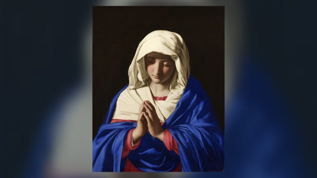 Nossa Senhora em oração com a cabeça coberta, modelo de quem usa o véu na missa