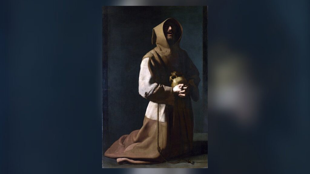 São Francisco de Assis ajoelhado com o hábito e o cordão dos frades franciscanos