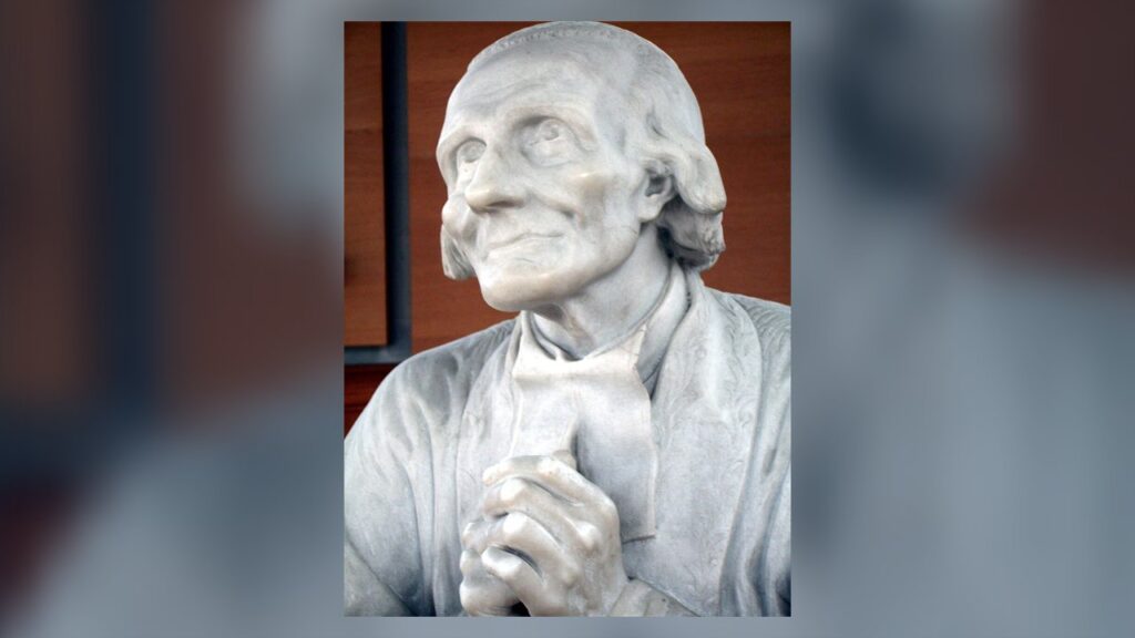 São João Maria Vianney em oração, estátua de mármore em Ars: o cura d'Ars, modelo do padre diocesano