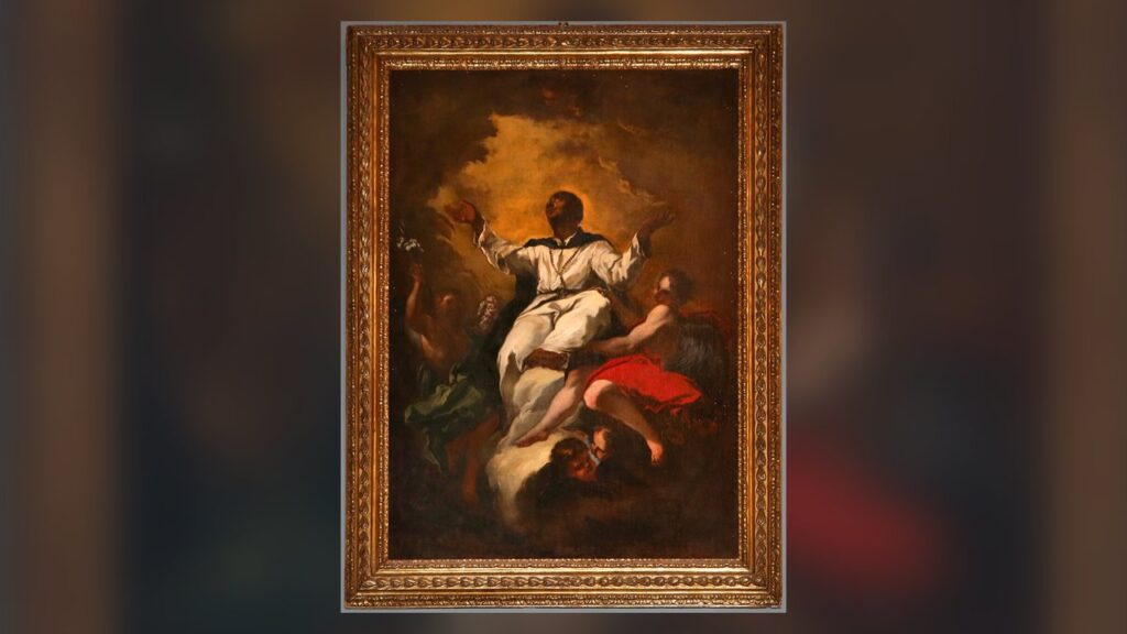São Martinho de Porres, irmão dominicano não ordenado, de hábito branco, elevado pelos anjos